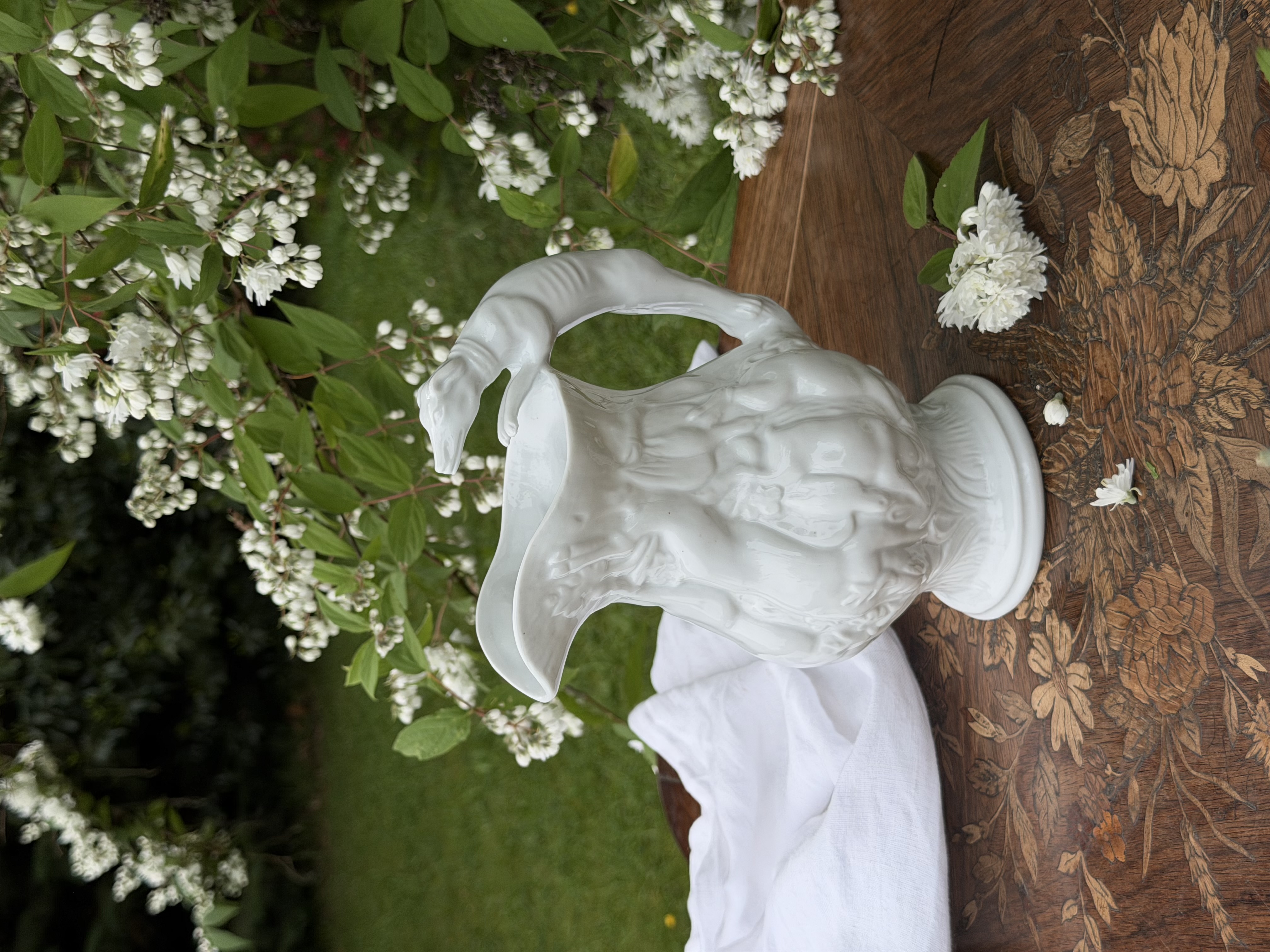 Hunting pitcher styled with white linen