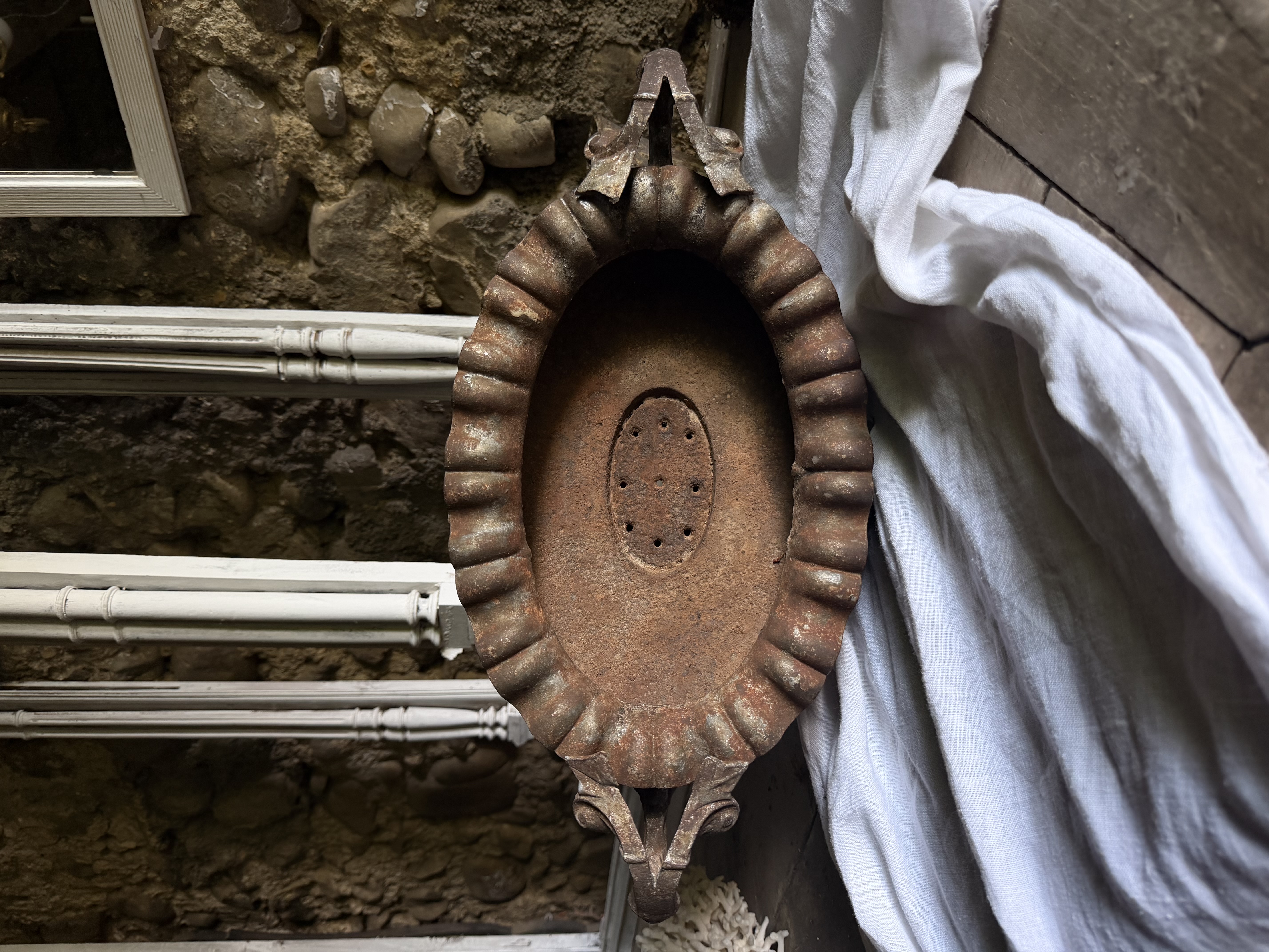 Scalloped rim and floral garland relief detail in the basin