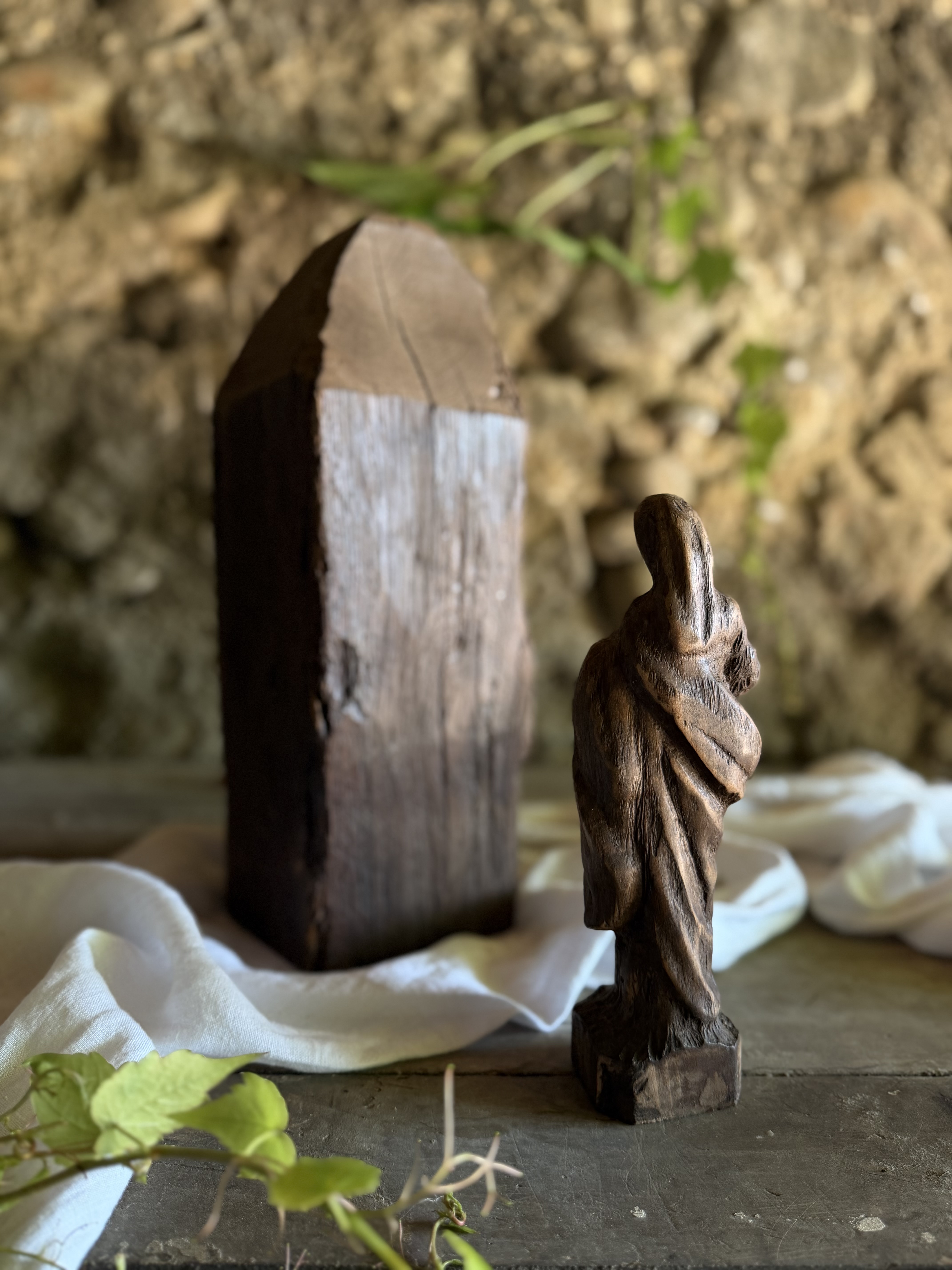 Angled view showing the deep, rustic texture of the carved wood