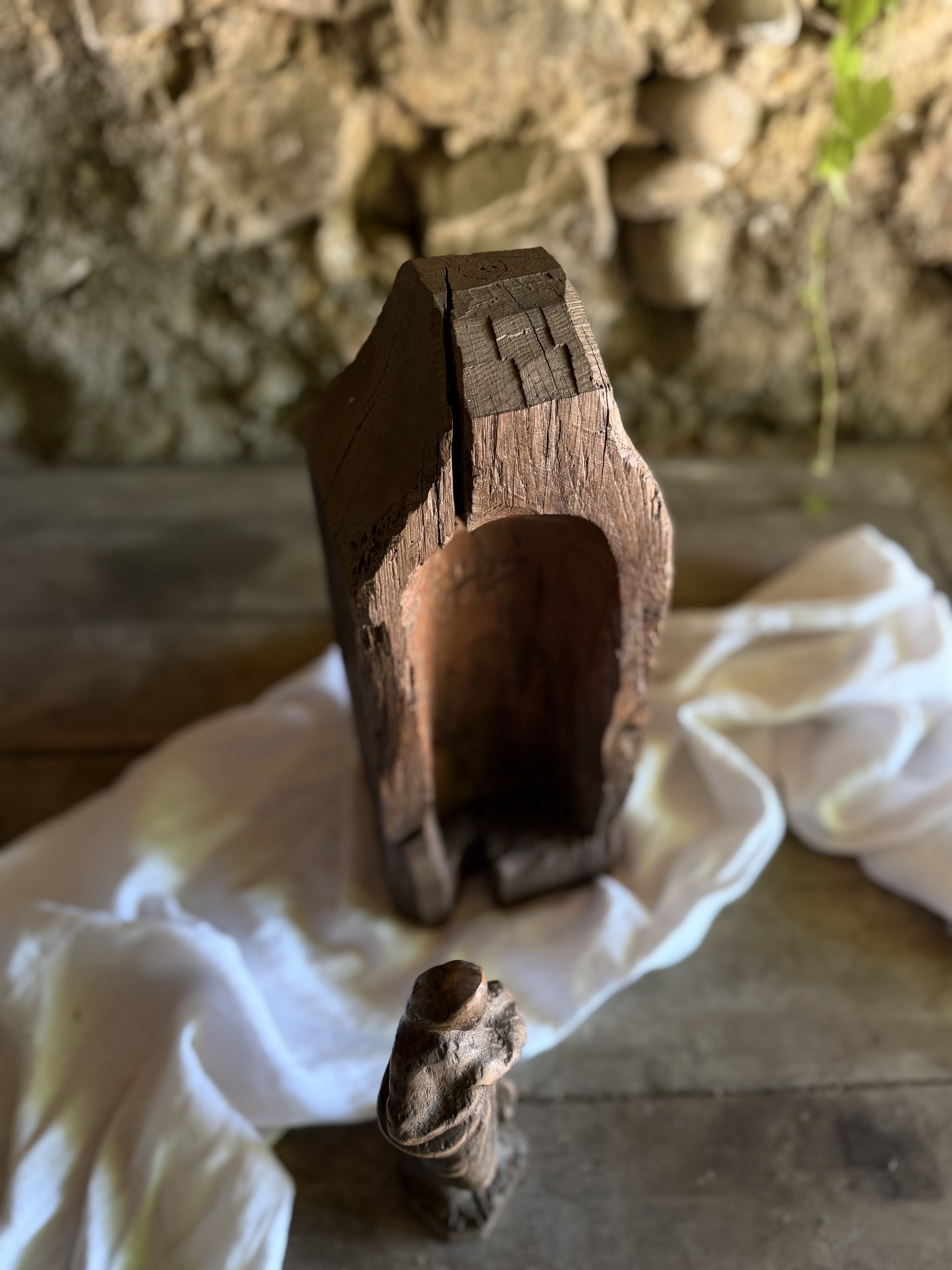 Overhead view highlighting the hand-hewn rooflines and split in the ancient wood