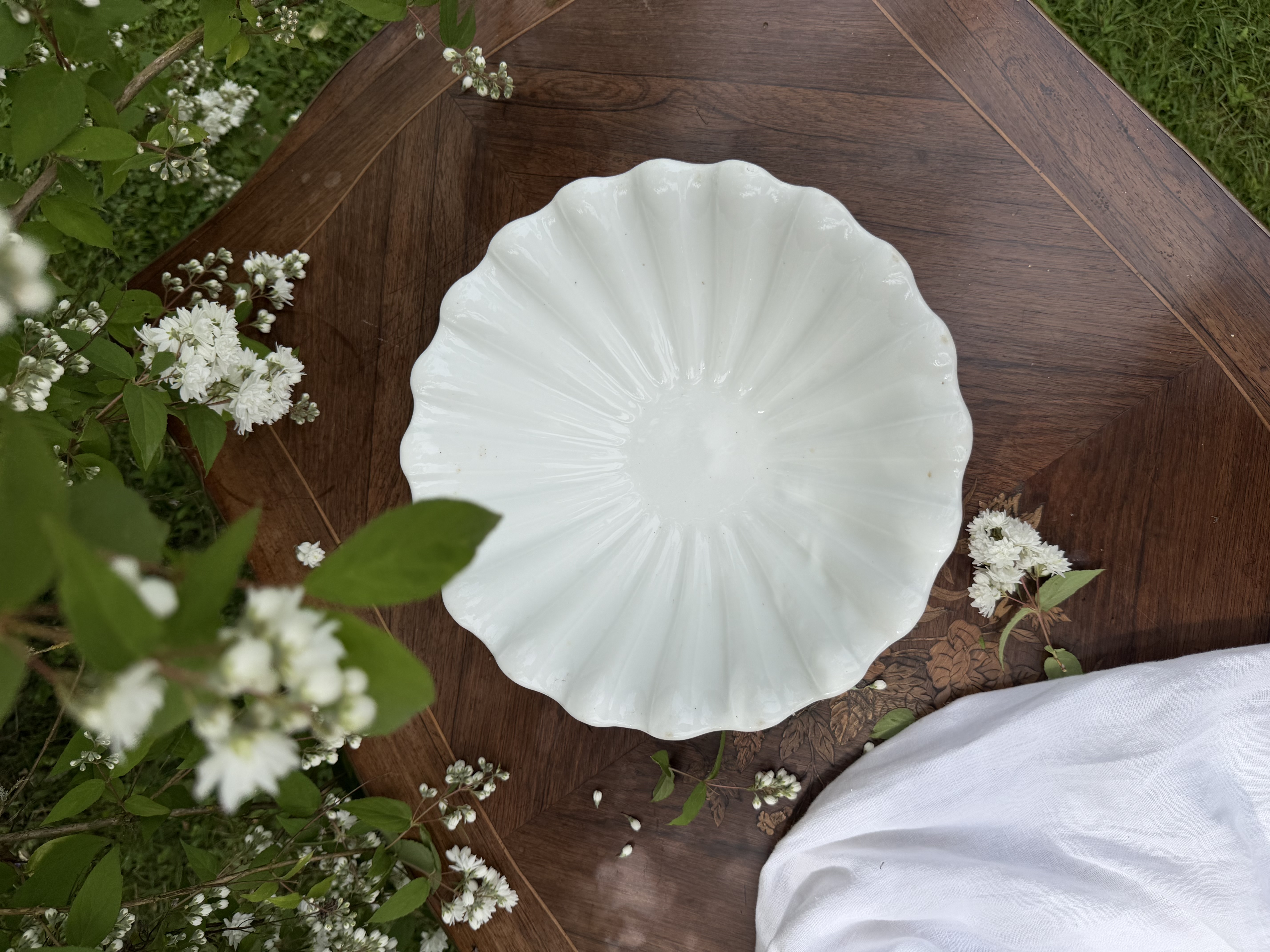 Overhead view showing the radial fluting of the antique French bowl