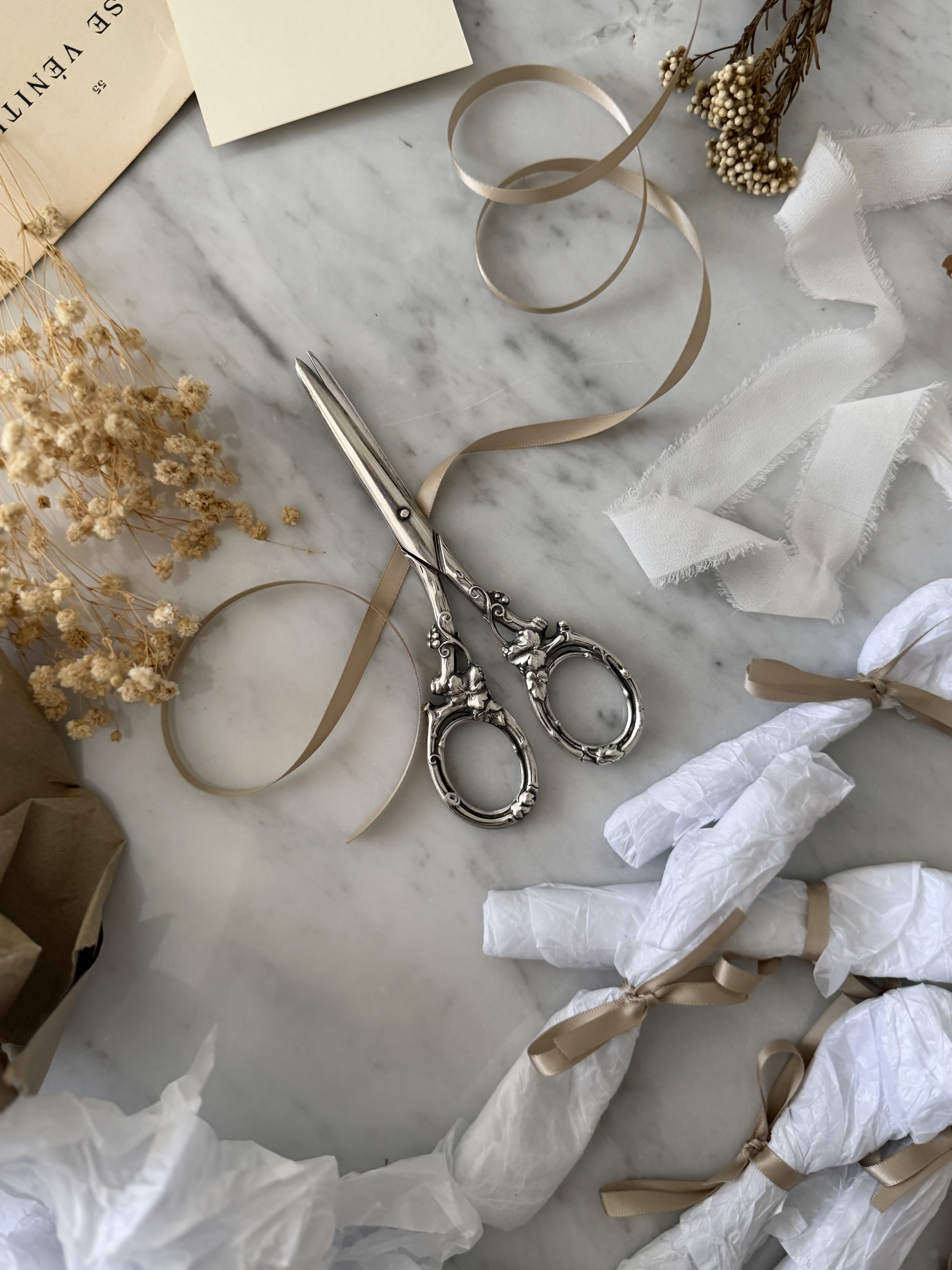 Beautifully styled antique scissors with dried botanicals