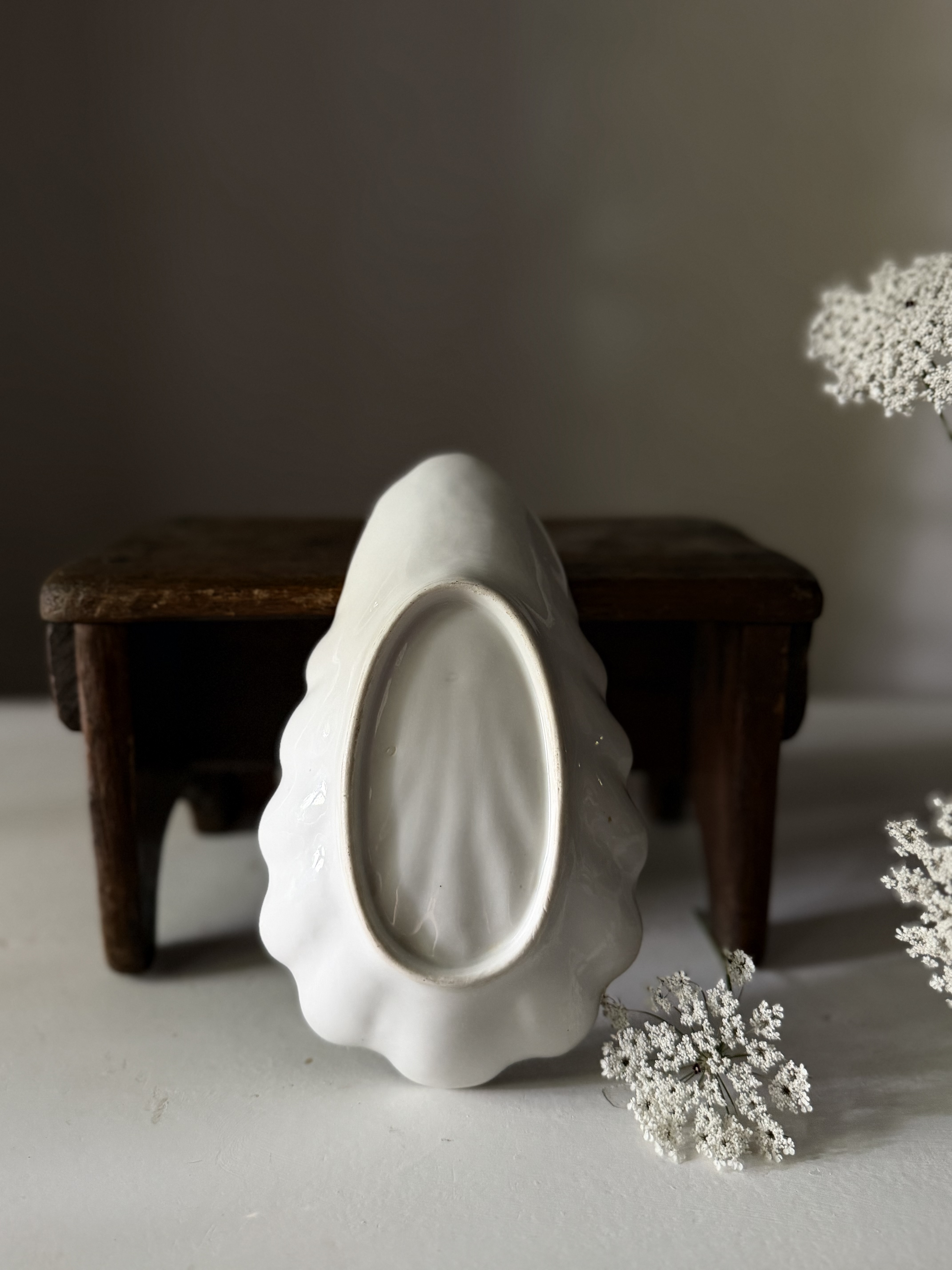 Reverse side of the antique French relish dish showing the unglazed foot