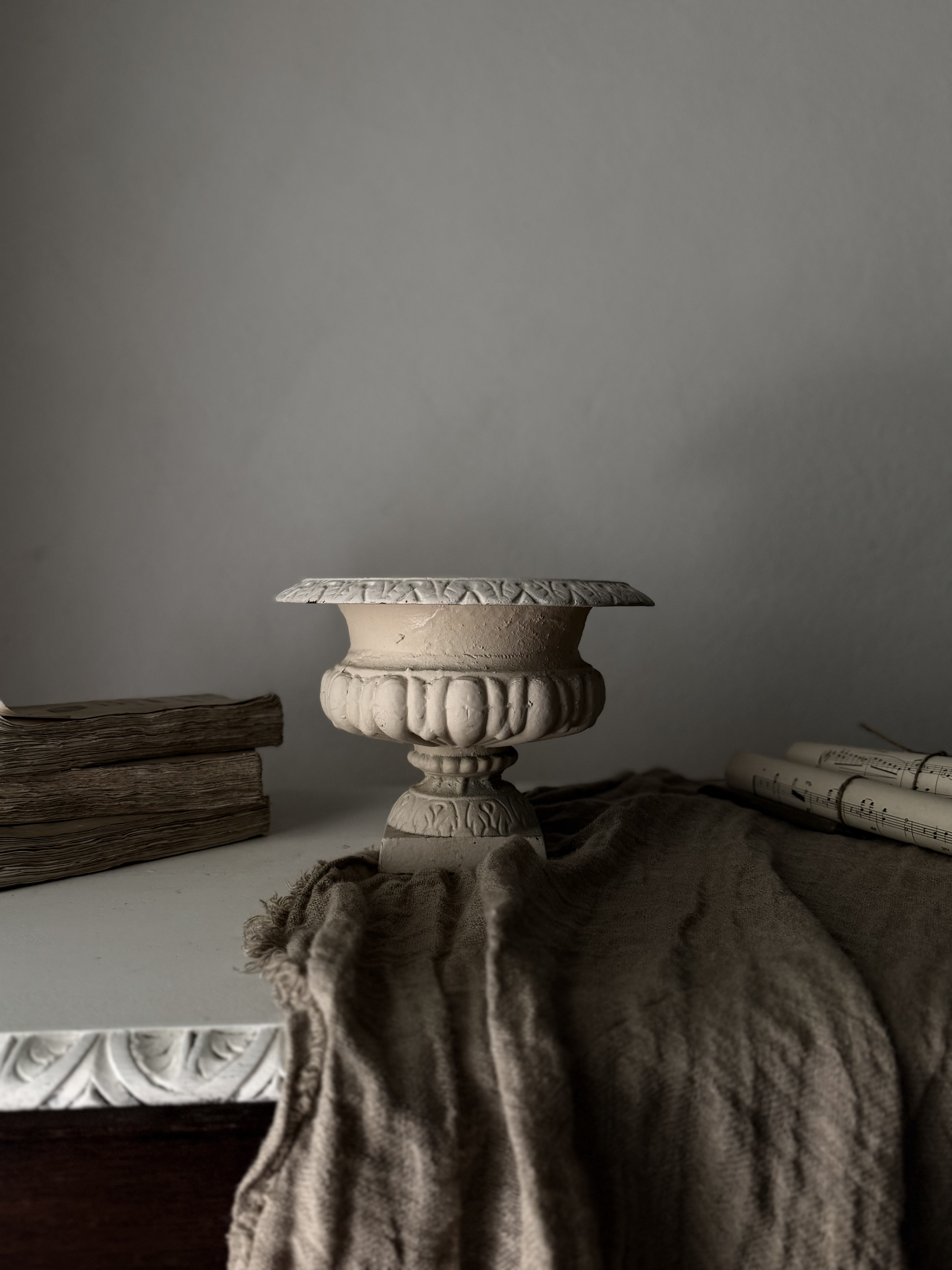 Antique French cast iron jardiniere in a soft stone hue
