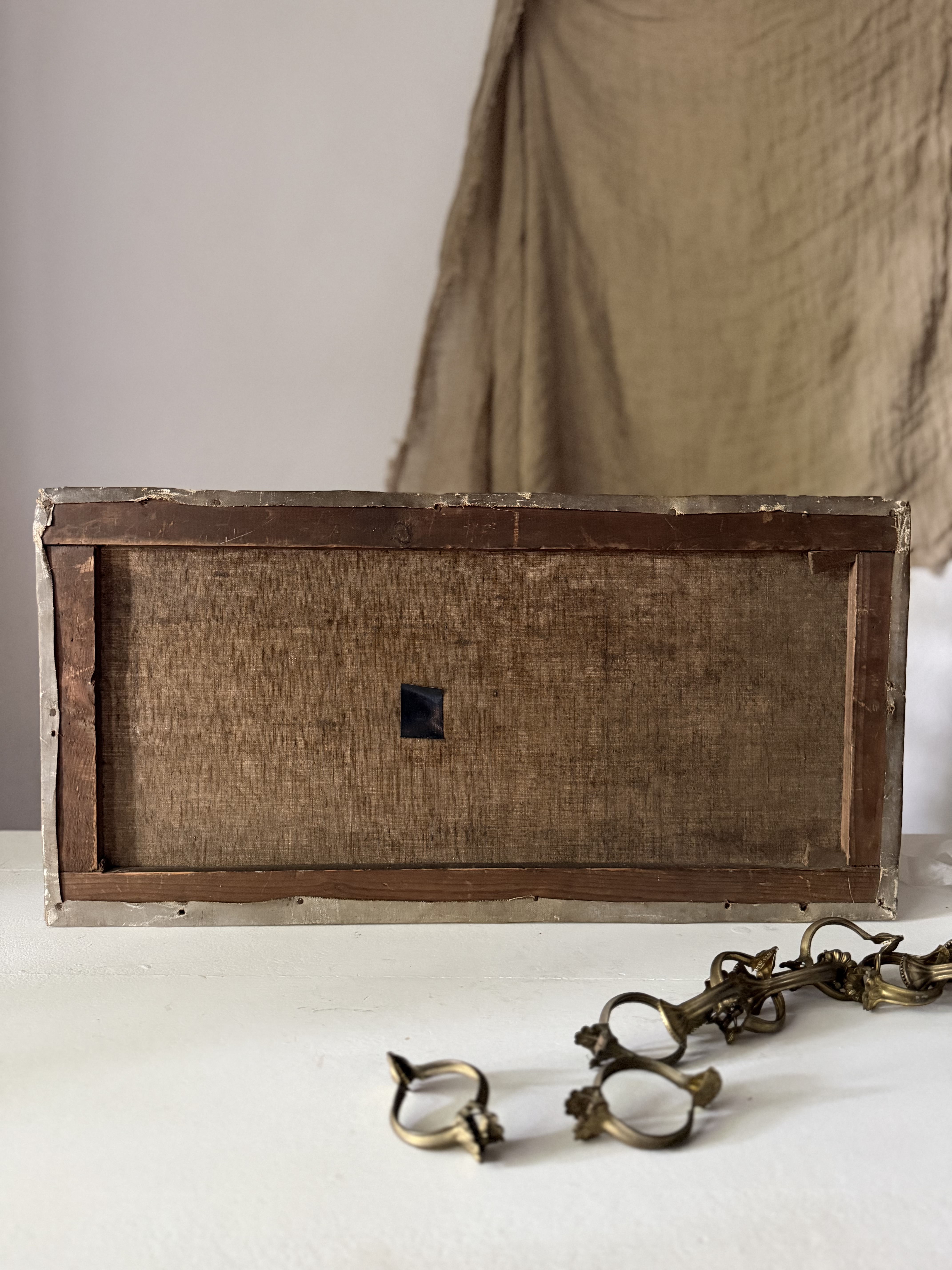 Reverse side of the canvas showing the beautifully aged wooden stretcher and evidence of repair