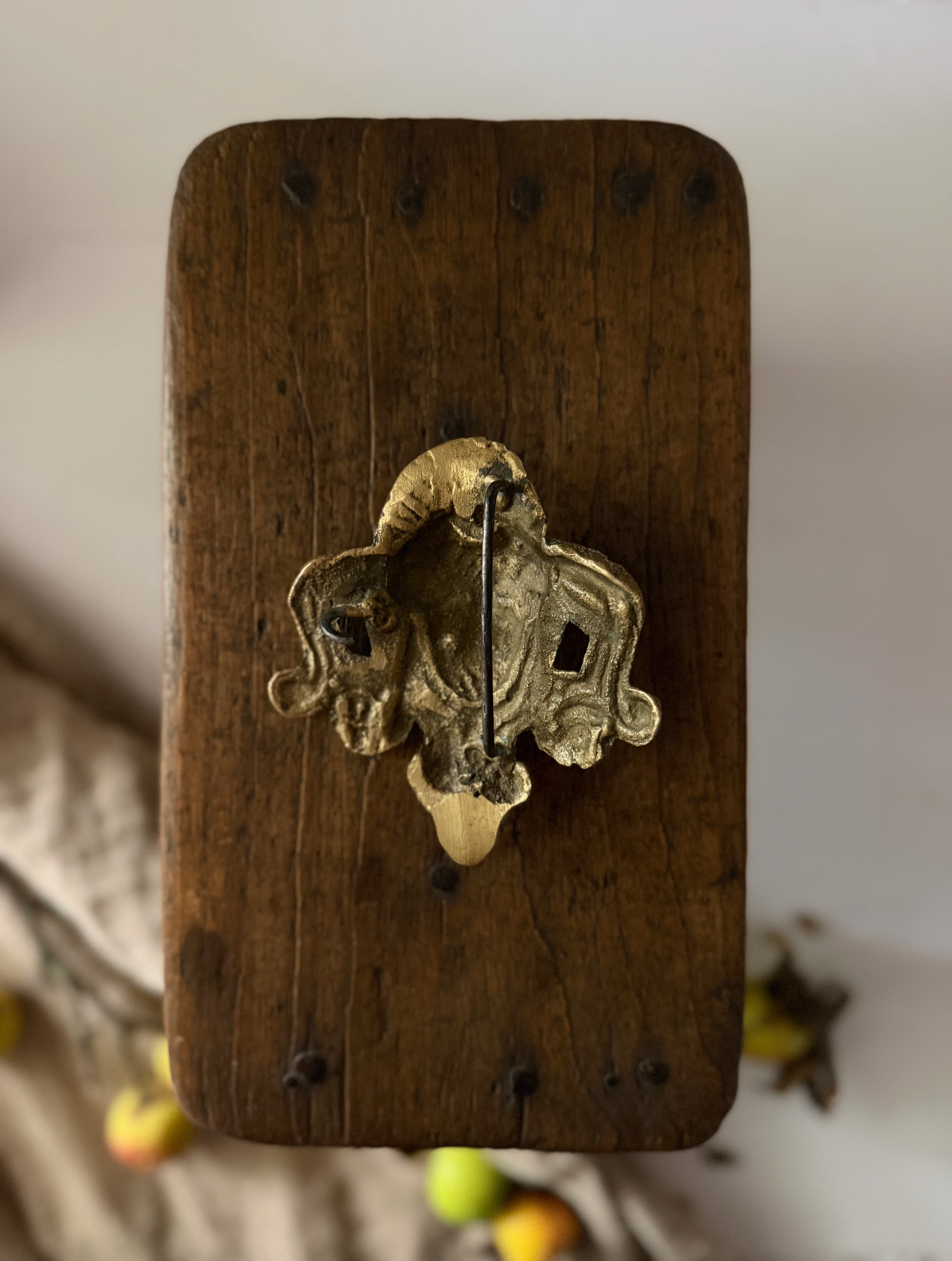The reverse of the bronze plaque showing the original heavy iron mounting bar