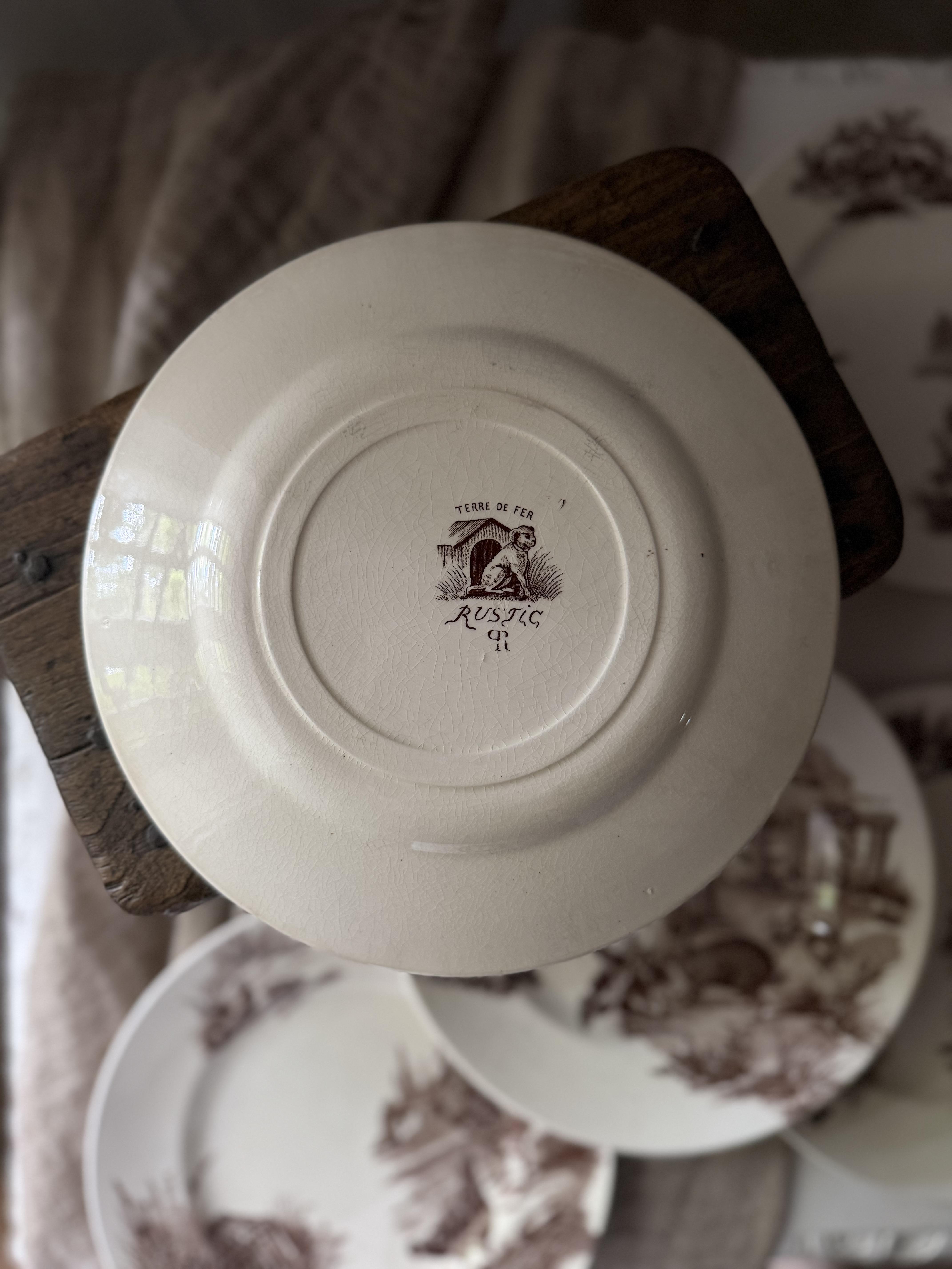 Close up detail of the sepia transferware plate featuring goats and chamois