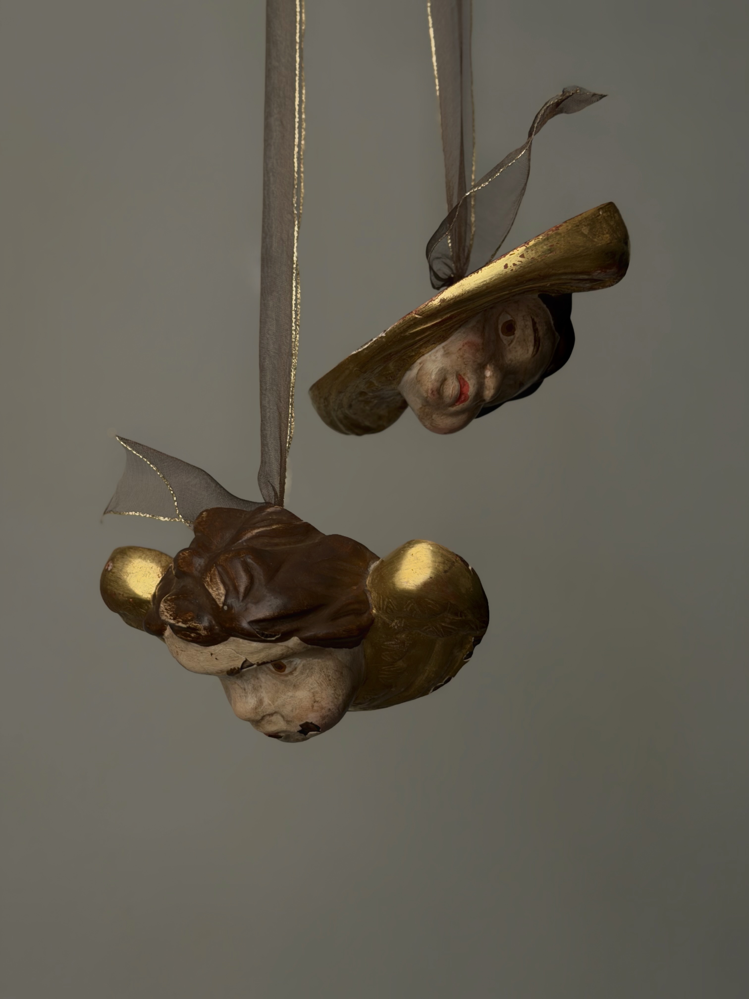 Alternate suspended angle showing the faces of the antique French cherubs